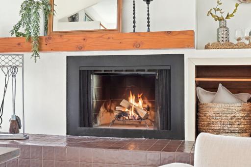 A wood mantel adds warmth and character to the main-level fireplace.