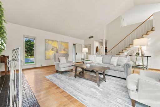 An airy main-level living space with warm hardwood floors and excellent natural light.