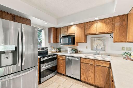 A well-planned kitchen with stainless steel appliances and abundant storage.
