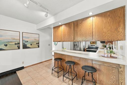 A convenient breakfast bar connects the kitchen with the surrounding living spaces.