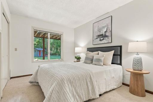 A comfortable secondary bedroom with natural light