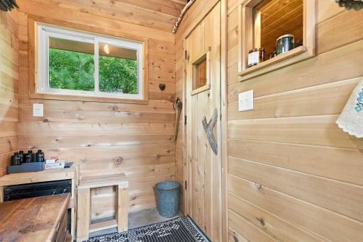 Thoughtful wood detailing completes the private backyard sauna.