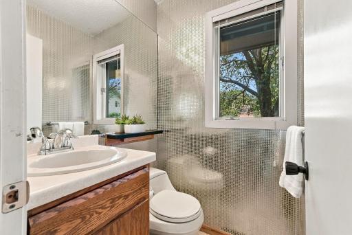 Natural light fills this well-appointed bath.