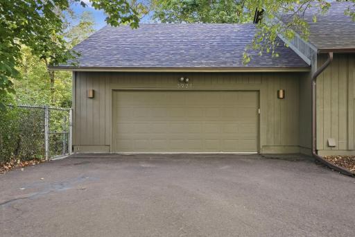 The attached garage provides convenient everyday parking and storage.