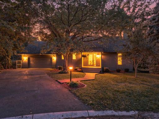 Mature landscaping gives the home a private, established feel from the street.