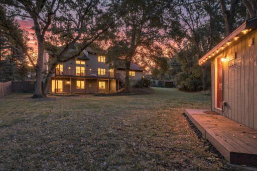 A generous backyard surrounded by established trees creates a wonderful sense of privacy.