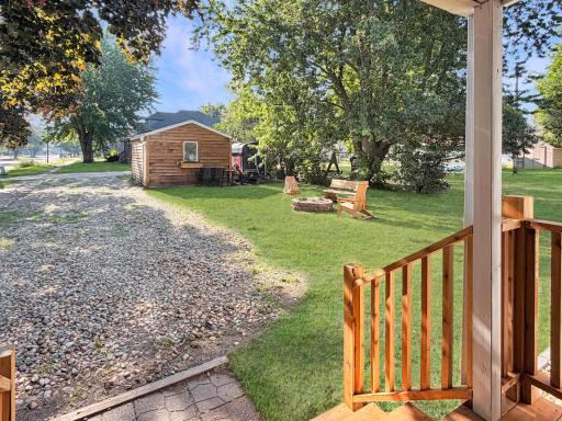 Overlooking the rear driveway with fire pit and garage in site
