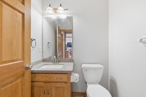 Main floor 1/2 bath off of laundry room & door into garage