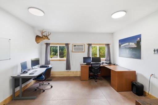 Main area used for 2 office spots & wall AC to keep cool