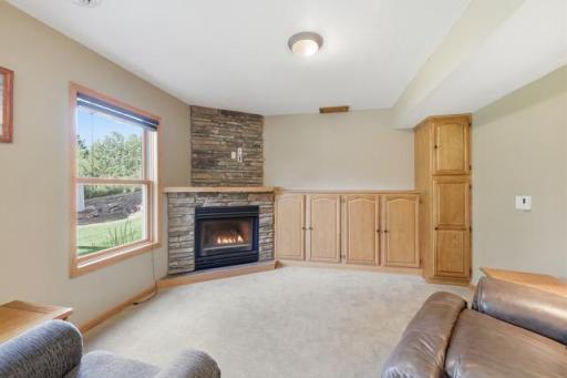 Family room with gas fireplace & storage