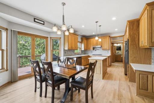 Dining room open to the kitchen area & patio door to the deck