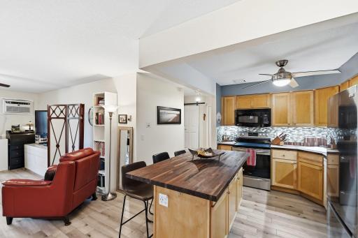 The black walnut, butcherblock, center island and countertops are unique and very attractive. New maple cabinetry, SS appliances, tiled backsplash and lighted ceiling fan, makes the kitchen the heart of the home!