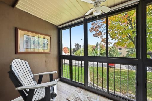 The 3-season porch features sliding glass windows and screens and is a terrific place to greet the morning with a hot cup of coffee!