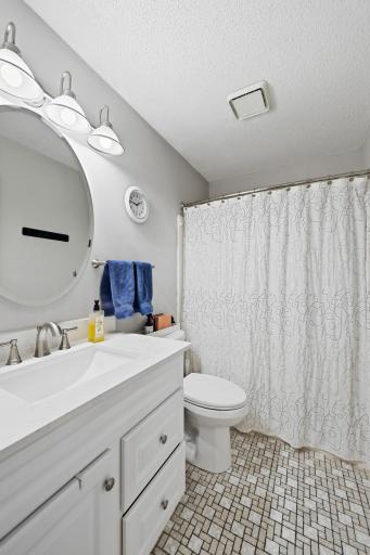 Another shot of the tiled bathroom with its new vanity.