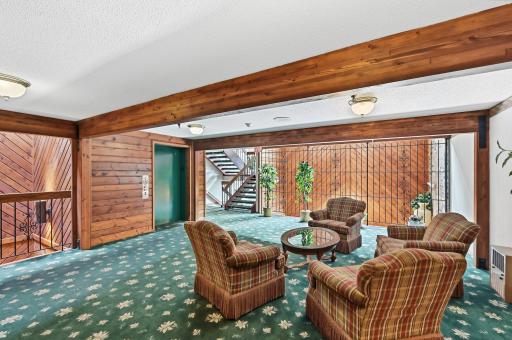 This picture is of the 2nd floor lobby area. The building has a warm and welcoming feeling and is well maintained.
Unit 210 is down the hallway to the left.