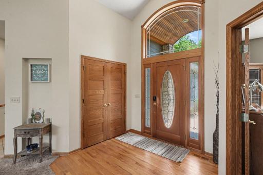 Hardwood floors in the entryway with a large double closet and open sightlines into the main living area.