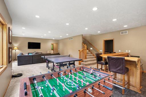 Lower level family room with rec space, showing the full footprint of this finished walkout.