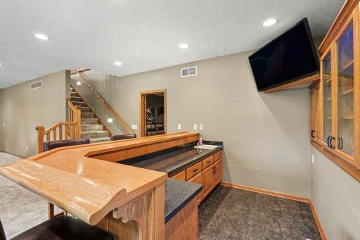 Additional angle of the lower level wet bar and entertainment area.