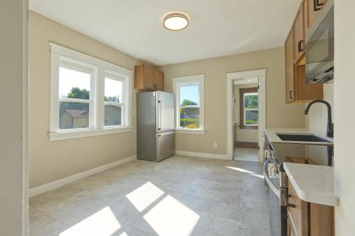 Modern kitchen with tons of windows and walk in pantry