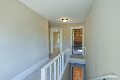Upper level loft to bedrooms and attic/storage room