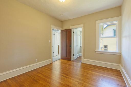 Bedroom 1 with walk in closet, next to bathroom
