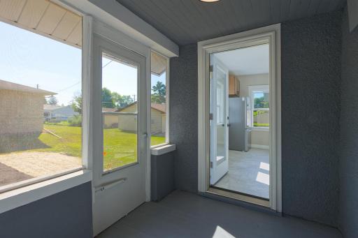 Newly screened porch with glass door to the kitchen