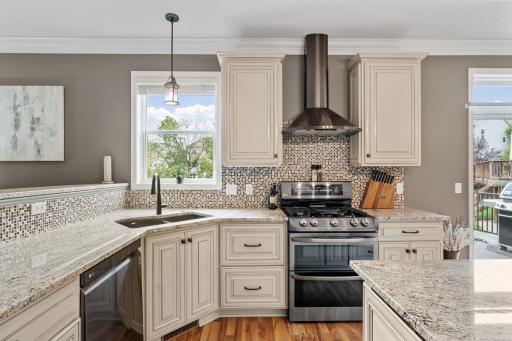 Stunningly remodeled Gourmet Kitchen w/ granite, new cabinetry, SS apps, gas range, Zephyr hood + Kinetico water filtration system