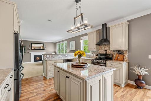 Stunningly remodeled Gourmet Kitchen w/ granite, new cabinetry, SS apps, gas range, Zephyr hood + Kinetico water filtration system
