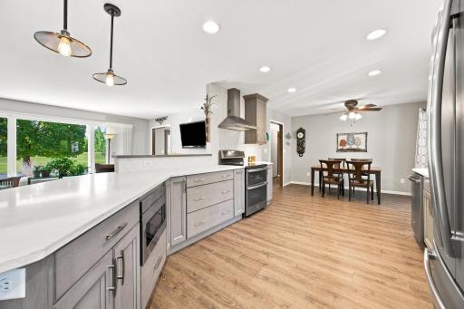 Updated kitchen with new soft close cabinets and drawers, quartz countertops, and LVP flooring
