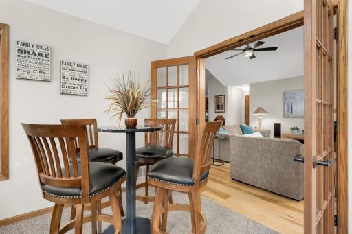 French doors separate the sunroom from the living room