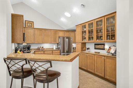 Kitchen has a breakfast bar and a stunning built-in buffet