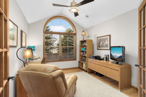 The office has French doors and an arched window.