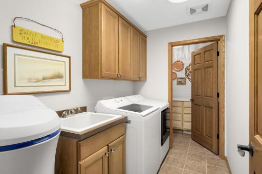 Laundry room with brand new washer & dryer. Plus additional storage room off the laundry.