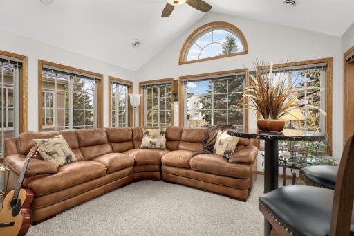 Inviting sunroom with two walls of windows!