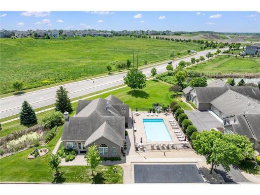Resort style clubhouse with a pool, community room, exercise room, and library.