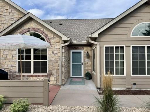 Front Entry and patio overlook green space and a pond