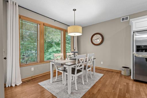 Special occasions are a cinch in wonderful dining area with more oversized windows