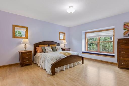 Main floor owners suite with wood floors.jpg