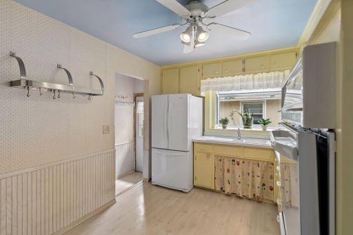 This kitchen is just plain sweet! There is room for a small table and chairs or a butcher block as well.