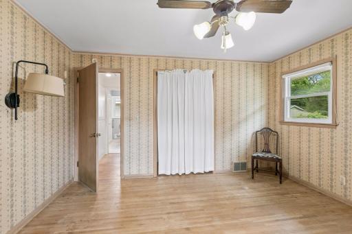 Another view of the main bedroom. Not in love with the curtains but imagine them replaced with a set of French doors.