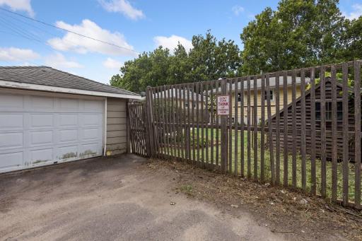 Oversized one stall garage needs some repair and painting.