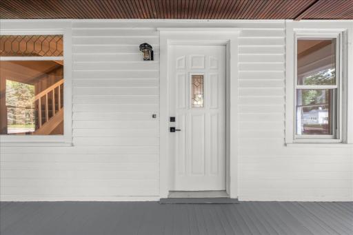 View of front entry from large screened in porch which was Freshly repainted. New lighting and hardware were also added.