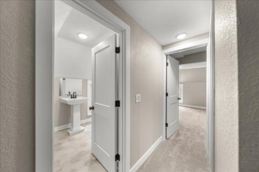 Upper level Hallway with view of Updated Full Bathroom and 2 bedrooms with all new doors, trim, paint, carpet & lighting!