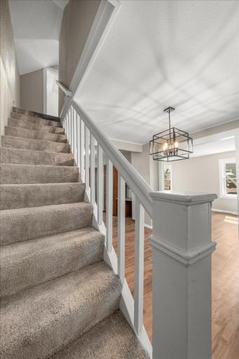 Staircase off of Dining room - leading up to 2 bedrooms & Full Bathroom.