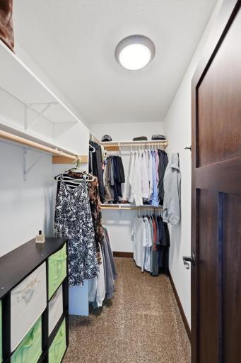 Spacious walk-in primary closet.