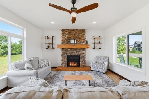 Stone fireplace with beautifully crafted wooden mantel & hearth.