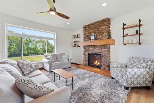Expansive windows usher light into the main floor living area.
