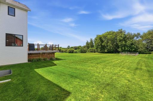 Level lot, in-ground sprinklers & room to roam.