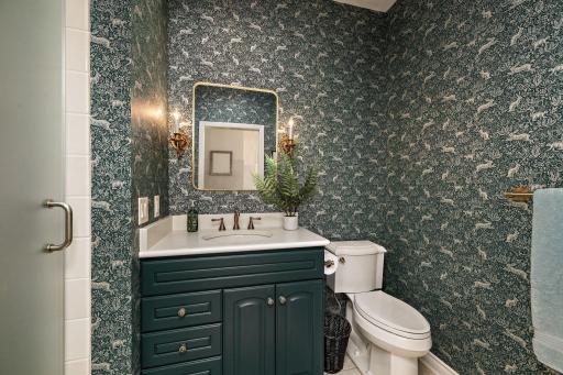 Guest 3/4 bath with updated vanity and heated marble floor.