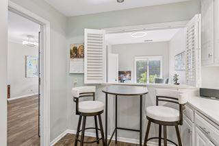Pass thru dining area with white luxury shutters!